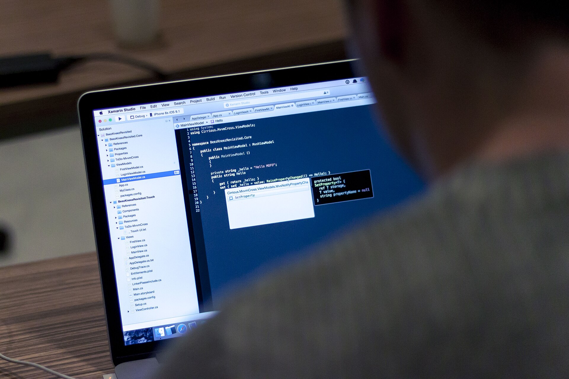 Laptop with code for Python Django and PHP freelance work